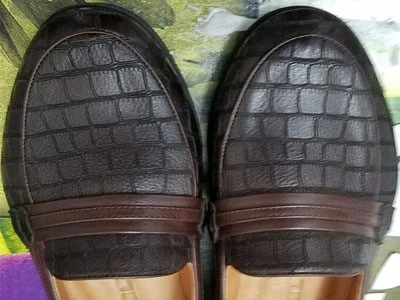 Laser marking in men's leather shoes